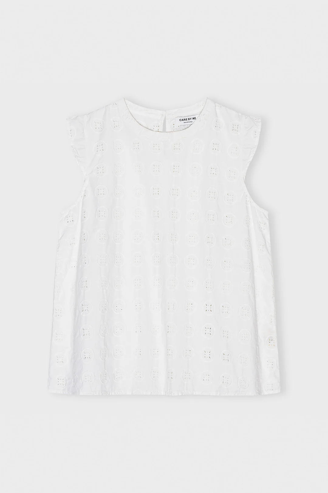 Klassisk top med rund hals og uden ærmer. Overdelen har det smukkeste broderi anglaise, som kan kombineres med nederdel i samme mønster.