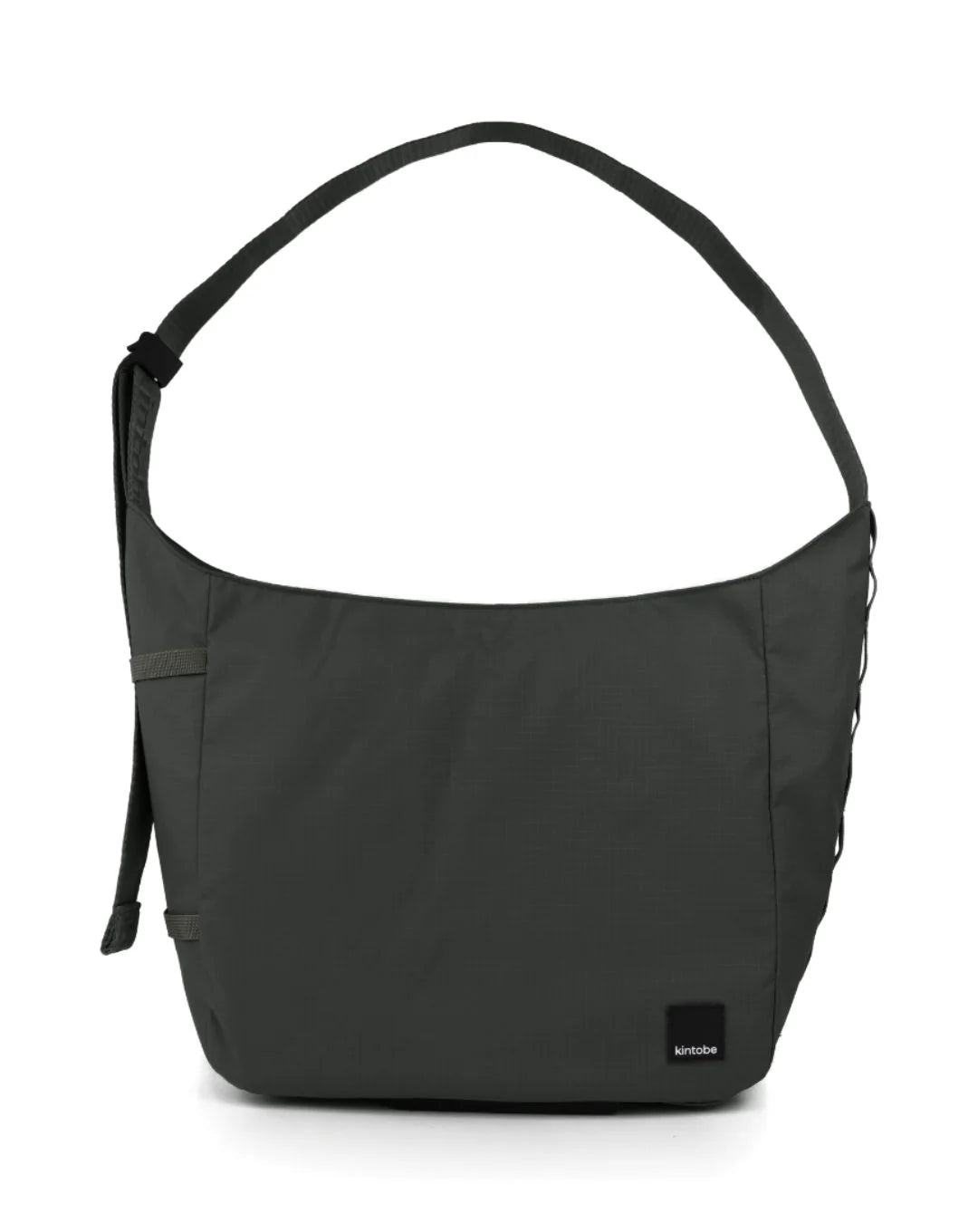 Kintobe TOBY crossbody-taske i Zen Green med justerbar rem og praktiske webbing-løkker – køb hos butikalrum.dk.