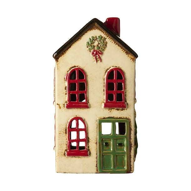 Dekorativt keramikhus fra Ib Laursen med krans i gavlen, til fyrfadslys og hyggelig dekoration