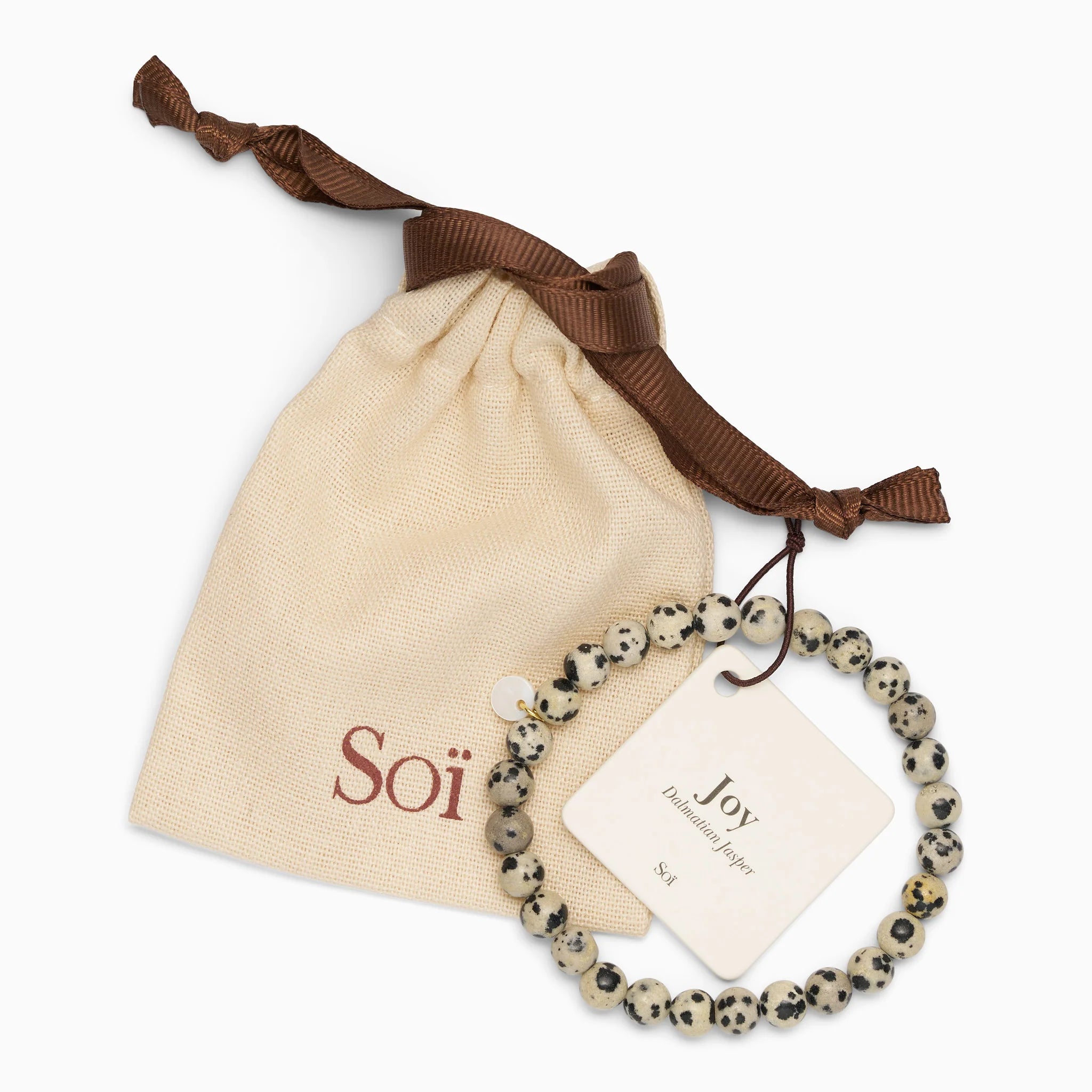 Essential dalmatiner jaspis stretch armbånd fra Soï Copenhagen med sorte prikker og 18k guldbelagt sterlingsølv