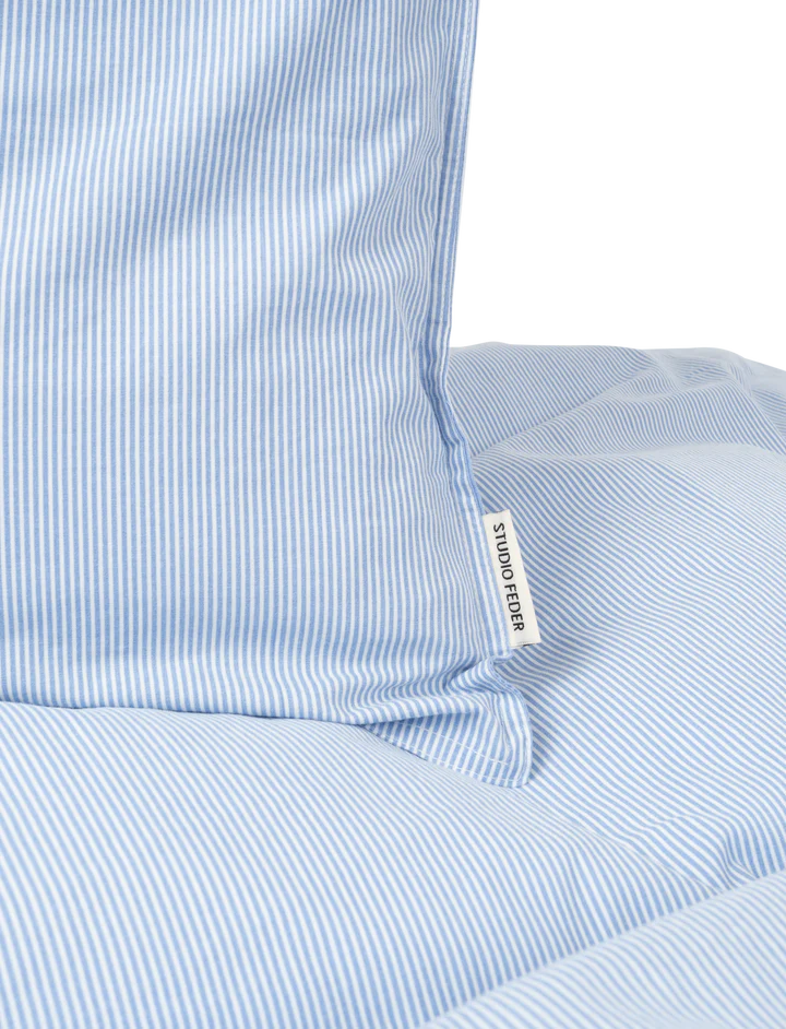 Sengetøj i økologisk bomuldspercale med Milk Stripe fra Studio Feder – sælges hos Butik Alrum på Amager.