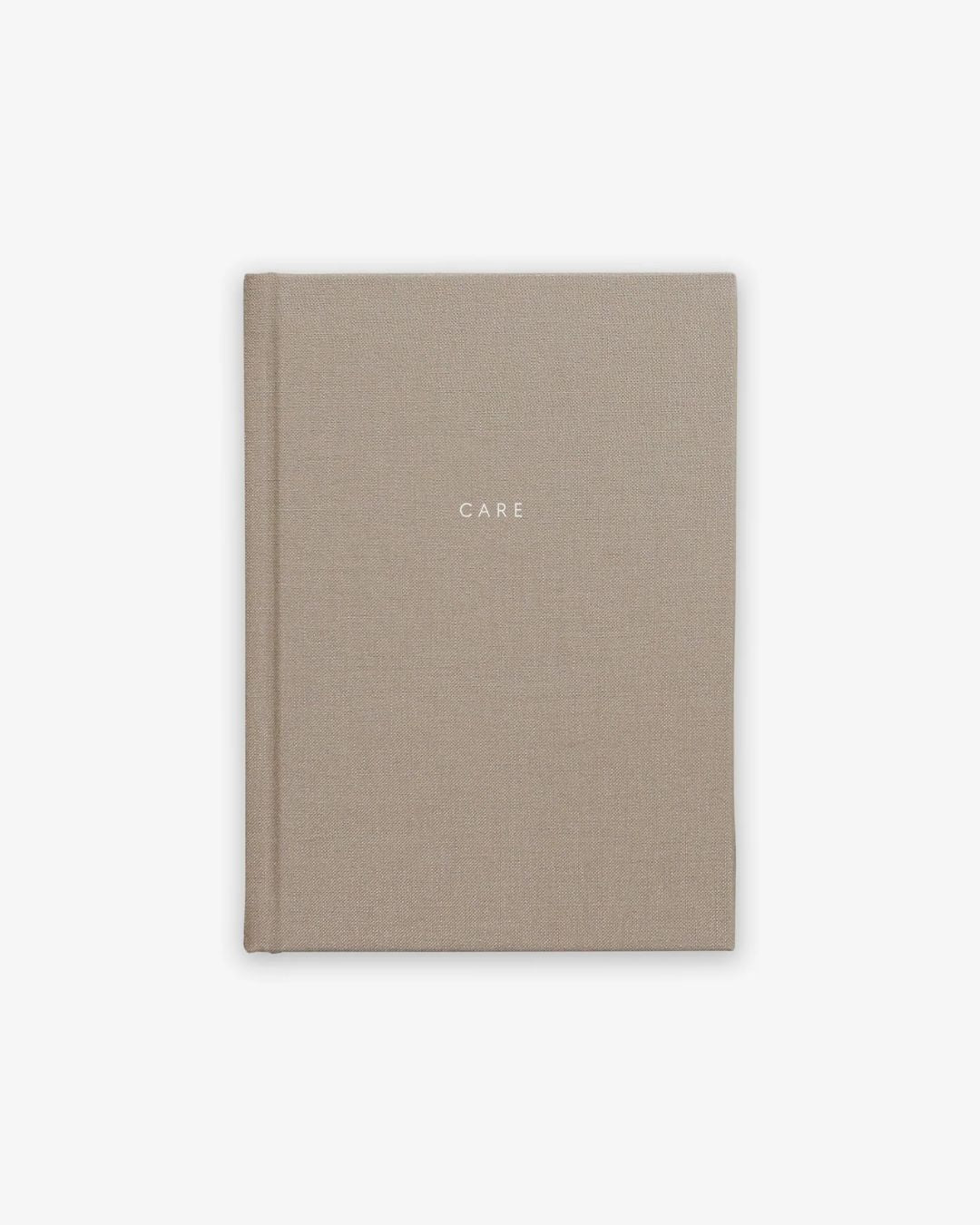 Care Journal – beige, stofindbundet guidet notesbog til daglig refleksion og selvomsorg.
